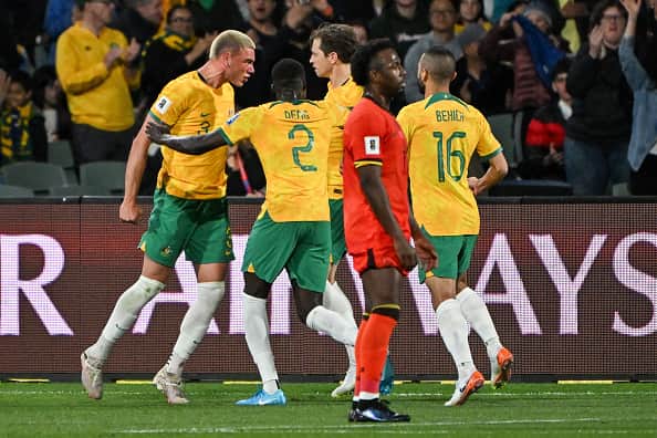 Mr Angry-Happy! Miller celebrates with his Socceroos team-mates after equalising in a moment of high drama.