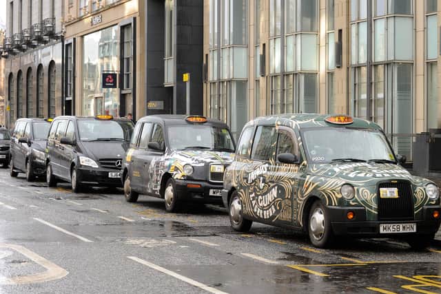 Stock photo of row of Edinburgh taxis.
