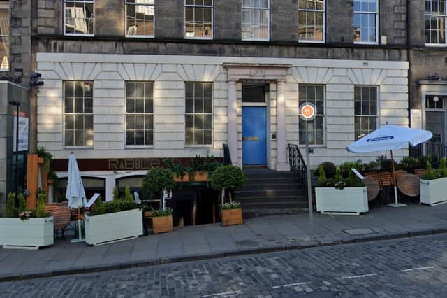 The Frederick Street office behind the blue door would be transformed into a new fast food restaurant under the plans.