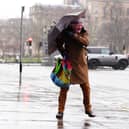 A member of the public battles with an umbrella in the wind during Storm Eowyn on George Street, Edinburgh. Schools have been closed and people warned not to travel on Friday, as 100mph winds pose a danger to life in parts of the UK as Storm Eowyn hits the country.