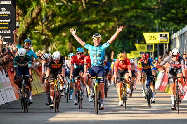 Britain's Mark Cavendish (C) celebrates as he crosses the finish line during the third Tour de France Singapore Criterium race in Singapore on November 10, 2024 (Pic: Getty)