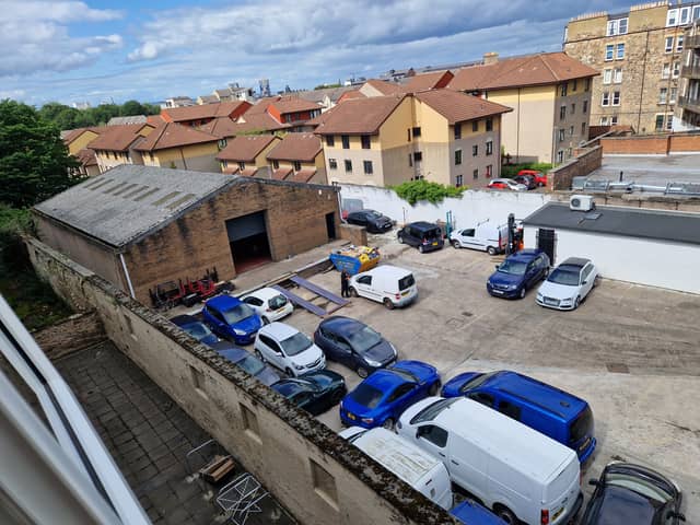 The current site off Leith Walk houses a warehouse car park and small storage building.