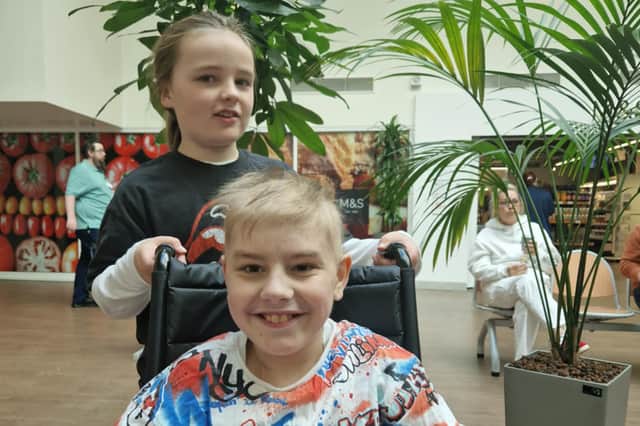 Kit Smith, pictured in hospital with his brother Tait.