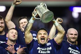 Scotlands Sione Tuipulotu lifts the Calcutta Cup during a Guinness Six Nations match between Scotland and England (Pic: SNS)