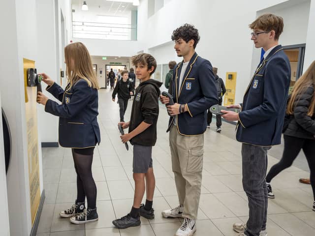 Pupils at Portobello queue up to unlock their phone pouches 