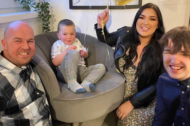 James McPherson pictured at home with his kids Harry, Jaime and Cameron.