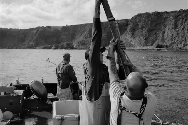 Salmon net fishermen in a coble, a type of flat-bottomed boat, harvesting sea trout from a bag net at Boddin Point at the north end of Lunan Bay, Angus, 2025. PIC: Colin McPherson