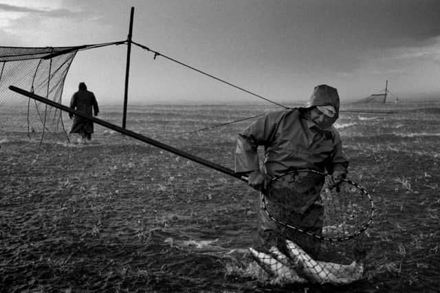 Salmon net fishermen Jim Mitchell (right) and Bob Ritchie fishing a 'jumper' net in a hailstorm at Kinnaber, Angus, 2000. PIC: Colin McPherson