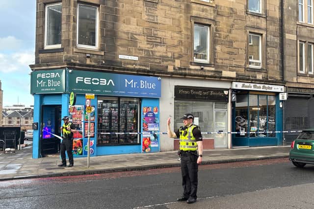 Edinburgh road taped off by police after 'stabbing' leaves man in hospital