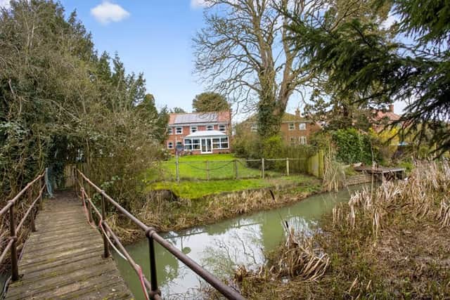 Follow the bridge at the bottom of the garden to your own private oasis