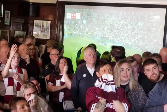 Fans watching the match at the Tynecastle Arms
