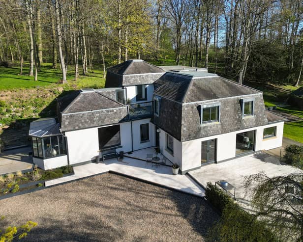 Orchard Wood is set within stunning gardens and grounds of approximately 1.7 acres with sweeping lawns, mature woodland and the Belsis Burn running along the southern border. A private driveway off the shared lane leads to a modern detached double garage with underfloor heating and an extensive gravelled parking area.