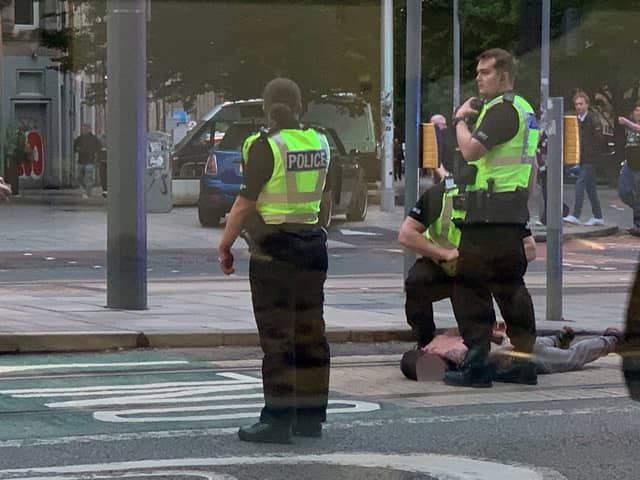 Police have arrested a man following a "series of incidents" around Edinburgh in which five people were injured. 