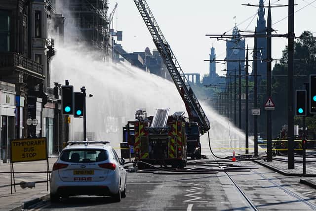 Firefighters at the scene of the blaze on Princes Street (Jane Barlow/PA)