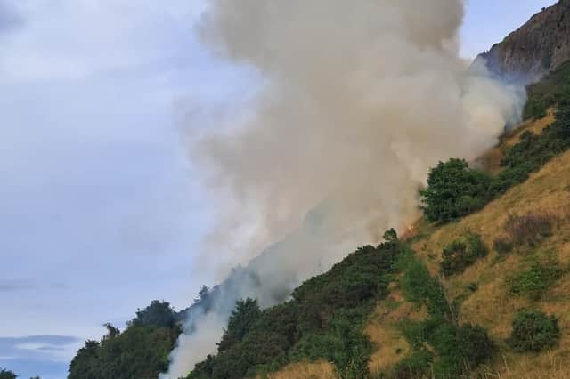 The fire is located at the base of Salisbury Crags, but appears to be spreading fast.