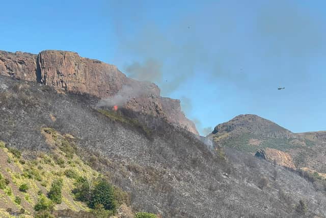 A blaze on Salisbury Crags reignited on Monday afternoon with fire crews continuing to work at the scene of the wildfire
