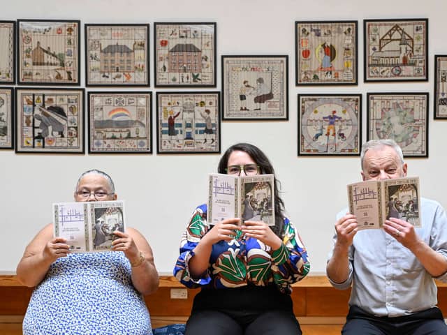 Craigmillar Tapestry stitcher Heather Henderson, Scottish Storytelling Centre's Lauren Paterson and Artist Andrew Crummy celebrate the launch of the Craigmillar Tapestry. Created by more than 500 residents of Craigmillar and Niddrie, the tapestry will be on display at the Scottish Storytelling Centre  (SSC) from 24 July until 31 August as part of its Fringe 2026 programme and the Centre's 20th anniversary celebrations.