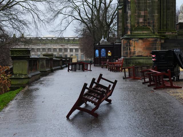 Wooden park benches blown over by the winds from Storm Eowyn in Princes Street Gardens, Edinburgh (Jane Barlow/PA)