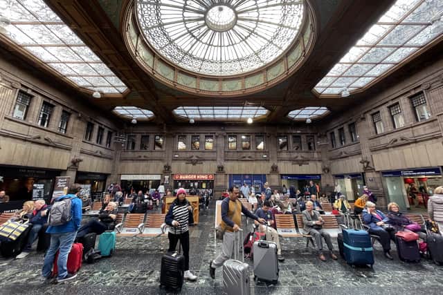Commuters and travellers at Edinburgh’s Waverley Station (Jane Barlow/PA)