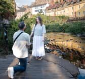 Andrew Shivak proposing to his girlfriend Emily Chess at Dean Village in Edinburgh on Thursday, August 13.