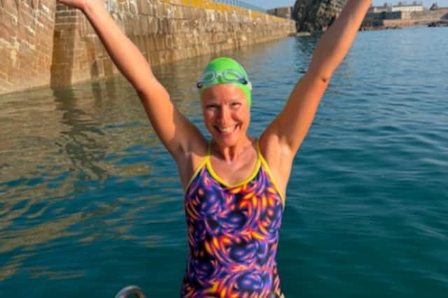 Nicky Mather, who was diagnosed with breast cancer in 2022 complete her 58km continuous swim around Jersey in 11 hours and 41 minutes.