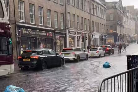 Fringe-goers waded through sodden streets during a flash flood in August