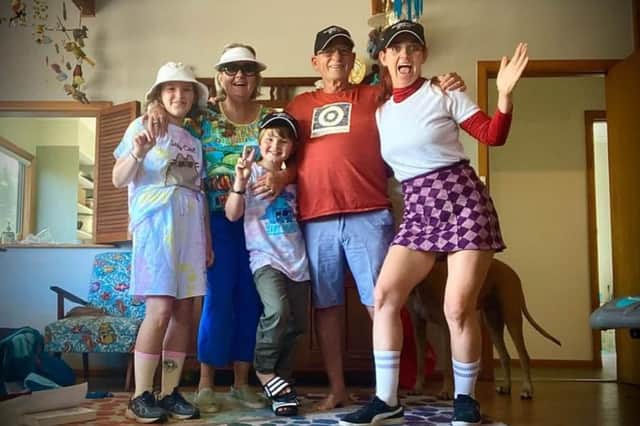 Elizabeth and her family getting ready for mini golf at the beach house