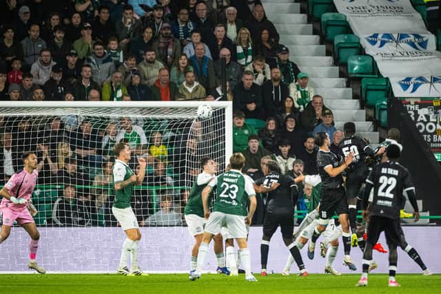 Christian Burgess heads home Gent's leveller against Hibs.