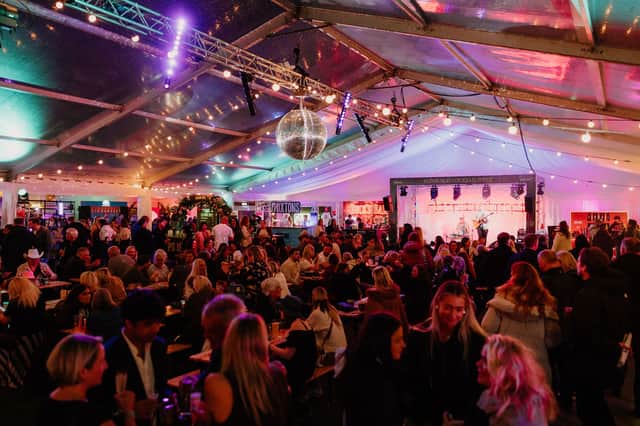 Inside the Edinburgh Cocktail Week Cocktail Village tent in Festival Square.
