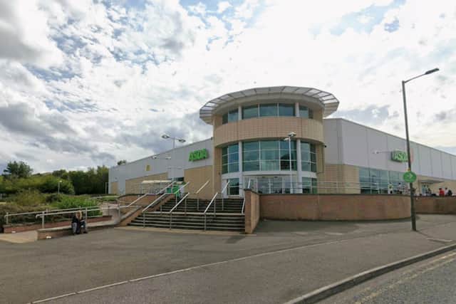 A man has been left in a "serious" condition after being found injured outside an Asda supermarket near Slateford Road.