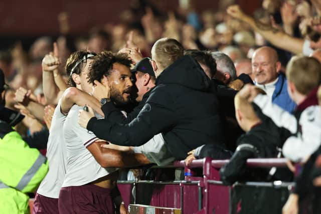 JJ Williams takes the acclaim of the Hearts fans after opening the scoring against Stenhousemuir.