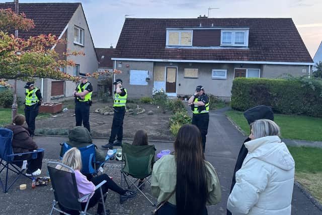 Residents protesting outside Calum McFadyen's Musselburgh home on Friday, with police in attendance.