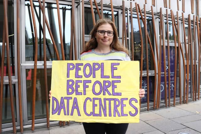 A demonstrator protesting against AI data centres at a previous event outside the Scottish Parliament.