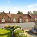 The traditional sandstone exterior gives this rarely available East Saltoun bungalow its distinctive character