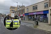 The suspect entered the shop on High Street in Dalkeith armed with a "sharp object" before stealing a number of items. 