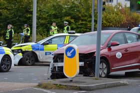 A police car collided with a red taxi while trying to get the teens to stop