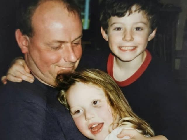 A photo of Stevan McIntosh, with his children Catrina McIntosh and Sean McIntosh In the 1990s.