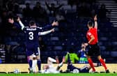 Scotland Appeal for a penalty as Josh McPake goes down in the box during a UEFA Nations League match between Scotland and Slovenia at Barclays Hampden