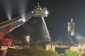 Fire fighters tackled the fire from above has the home turned to blackened rubble