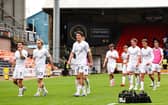 Falkirk's Lewis Neilson (C) and teammates at full time during a William Hill Premiership match between Dundee United and Falkirk 