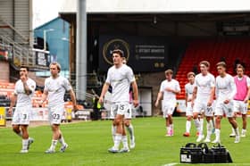 Falkirk's Lewis Neilson (C) and teammates at full time during a William Hill Premiership match between Dundee United and Falkirk 