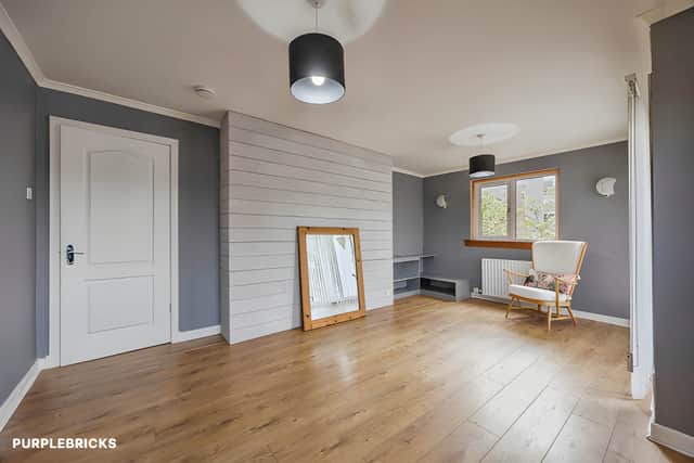 The bright and spacious lounge offers a welcoming setting for relaxing and entertaining in this two-bedroom Edinburgh flat