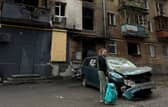 Maria outside her burnt-out home in Kyiv 