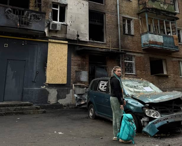 Maria outside her burnt-out home in Kyiv 