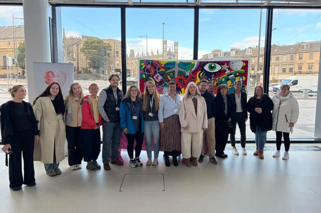 Bereaved parents joined forces to help add names to a Baby Loss Awareness Week 'Milestone Mural' at Omni Centre in Edinburgh.