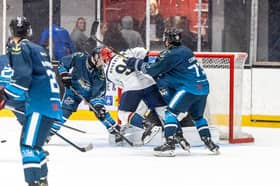 The action get rough for Edinburgh Capitals man Callie Robertson in front of the Solway Net.