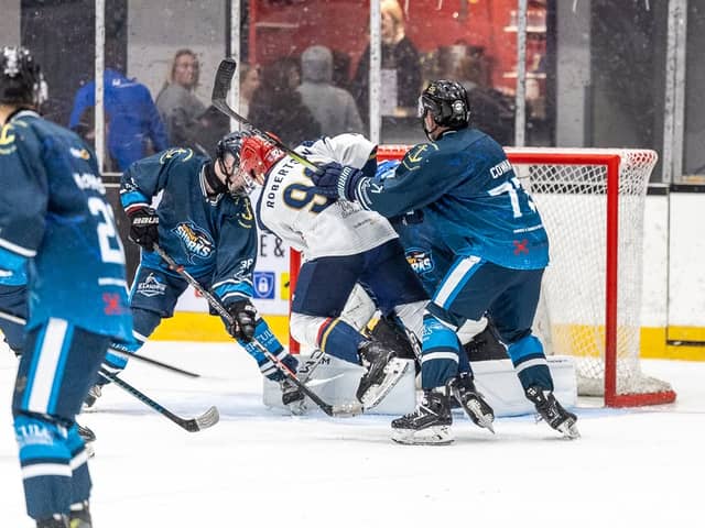 The action get rough for Edinburgh Capitals man Callie Robertson in front of the Solway Net.