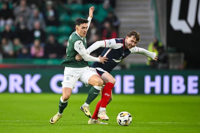 Hibernian's Jamie McGrath and Falkirk's Connor Allan in action