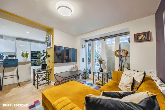 The bright living area offers a welcoming place to relax or entertain, forming the heart of this two-bedroom Edinburgh home.