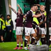 Hearts' Calvin Miller (L) and teammates celebrate as Josh McPake scores to make it 3-1 during a William Hill Premiership match between Hibernian and Heart of Midlothian